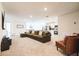 Bright and airy living room featuring an open concept design, seamlessly connected to the modern kitchen at 2925 Sw 172Nd Lane Rd, Ocala, FL 34473