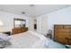 Serene bedroom featuring light blue walls and classic wood furniture at 3030 Kingfisher Dr, Orlando, FL 32806