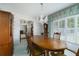 Formal dining room features an elegant chandelier, large table, and classic accents at 3030 Kingfisher Dr, Orlando, FL 32806