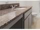 Bathroom with granite countertop, sleek vanity, neutral colors, and modern fixtures at 304 Towns Cir, Haines City, FL 33844