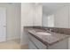 Bathroom featuring granite countertop, sink, modern fixtures, and neutral finishes at 304 Towns Cir, Haines City, FL 33844