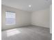 Neutral bedroom with natural light, soft carpet, and a calming atmosphere at 304 Towns Cir, Haines City, FL 33844