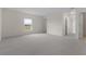 Large, bright bedroom featuring a window and plush carpeting for comfort at 304 Towns Cir, Haines City, FL 33844