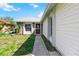 Inviting front entrance with screen door, beautiful landscaping and side windows at 3175 Arrowhead Ln, Kissimmee, FL 34746