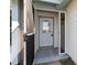 Open view of front door with screen door and lantern at 3175 Arrowhead Ln, Kissimmee, FL 34746