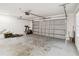 Large garage with an automatic door offers ample storage and workspace at 3175 Arrowhead Ln, Kissimmee, FL 34746