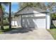 A well-maintained single-story home featuring a two-car garage and a spacious driveway at 3455 Jujube Dr, Orlando, FL 32810