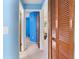 Hallway features a closet and access to multiple rooms, offering a glimpse of the home's layout at 3455 Jujube Dr, Orlando, FL 32810