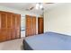 Serene main bedroom featuring ample closet space, a ceiling fan, and neutral tones for a relaxing atmosphere at 3455 Jujube Dr, Orlando, FL 32810