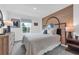 Bright bedroom featuring hardwood accent wall, basketball decor, and a comfy queen-size bed at 3489 Salvia Ct, Tavares, FL 32778