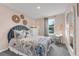 Cozy bedroom with coastal decor, creating a serene and inviting atmosphere at 3489 Salvia Ct, Tavares, FL 32778