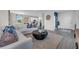 Spacious living room features an open concept with blue accent wall and modern decor at 3489 Salvia Ct, Tavares, FL 32778