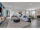Open-concept living room featuring a large sectional sofa and lots of natural light at 3489 Salvia Ct, Tavares, FL 32778