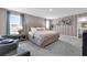 A luxurious main bedroom suite with neutral tones, carpet floors, and an en-suite bathroom at 3489 Salvia Ct, Tavares, FL 32778