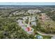 Aerial view of townhomes featuring mature landscaping and a community pool at 35 Misners Trl, Ormond Beach, FL 32174