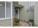 Close-up of home entrance with a decorative bicycle and potted plants at 35 Misners Trl, Ormond Beach, FL 32174