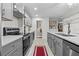 Modern kitchen featuring sleek gray cabinets and updated appliances at 35 Misners Trl, Ormond Beach, FL 32174