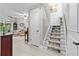 View of a staircase with carpet and wooden banister at 35 Misners Trl, Ormond Beach, FL 32174