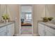 Bright bathroom featuring double vanities with granite countertops and views of the bedroom at 3590 Dahlia Dr, Haines City, FL 33844