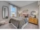 Cozy bedroom with soft carpet, a decorative dresser, and natural light from the window at 3590 Dahlia Dr, Haines City, FL 33844