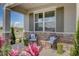 Inviting front porch with cozy seating and stylish accent chairs at 3590 Dahlia Dr, Haines City, FL 33844