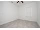 Bright bedroom featuring a ceiling fan, window, and ceramic tile flooring at 3892 Sw 130Th Loop, Ocala, FL 34473