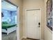 Hallway view towards bedroom showcasing cloud wallpaper accent and white trim door and frames at 4865 Clock Tower Dr, Kissimmee, FL 34746