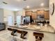 Beautiful kitchen features a breakfast bar, stainless steel appliances and granite countertops at 4865 Clock Tower Dr, Kissimmee, FL 34746