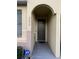 Inviting entrance with a covered entryway leading to the front door, ensuring protection from the elements at 5290 Paradise Cay Circle, Kissimmee, FL 34746