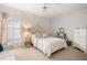 Comfortable bedroom with soft neutral colors, plush carpet, and ample natural light at 5940 Chesapeake Park, Unit # 47, Orlando, FL 32819