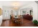 Elegant dining room with hardwood floors and stylish chandelier at 5940 Chesapeake Park, Unit # 47, Orlando, FL 32819