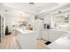 Well-lit kitchen with white cabinetry, tile floors, and an adjacent dining area at 5940 Chesapeake Park, Unit # 47, Orlando, FL 32819