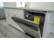 Stainless steel dishwasher with open door featuring energy guide at 613 James Ct, Poinciana, FL 34759