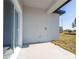 Covered patio featuring a sliding glass door and a view of the backyard at 613 James Ct, Poinciana, FL 34759