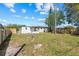 Large backyard with a new wood fence offering privacy and space at 7416 Kadel Way, Orlando, FL 32822