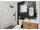 Chic bathroom with marble shower, wood vanity, and modern black accents at 7416 Kadel Way, Orlando, FL 32822