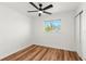 Bedroom with new floors, large window, and closet at 7416 Kadel Way, Orlando, FL 32822