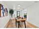 Bright dining room with a wooden table, seating for four, and natural light from the window at 7416 Kadel Way, Orlando, FL 32822