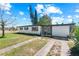 Inviting single-story home with fresh landscaping and a charming front entrance at 7416 Kadel Way, Orlando, FL 32822