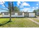 Charming single-story home featuring a well-maintained lawn and inviting curb appeal at 7416 Kadel Way, Orlando, FL 32822