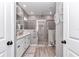 Modern bathroom featuring a glass-enclosed shower, double vanity, and neutral color palette at 7651 Sw 74Th Loop, Ocala, FL 34481