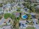 An aerial view showcasing the neighborhood's community pool, tennis courts, and residential homes at 7861 Copperfield Ct, Orlando, FL 32825