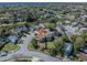 Aerial view of a home on a corner lot, pond, and green spaces in a residential neighborhood at 7861 Copperfield Ct, Orlando, FL 32825