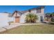 Charming two-story home with attached garage and well-manicured lawn under a clear blue sky at 7861 Copperfield Ct, Orlando, FL 32825