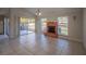 Bright living area with sliding glass doors and a cozy fireplace at 7861 Copperfield Ct, Orlando, FL 32825