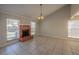 Inviting living room features a brick fireplace, tile flooring, and plenty of natural light from large windows at 7861 Copperfield Ct, Orlando, FL 32825