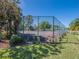 View of a community tennis court, showcasing the surrounding green spaces at 7861 Copperfield Ct, Orlando, FL 32825