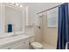 Bright bathroom with shower, modern vanity and mirror, plus cabinet for ample storage at 8606 Terrace Pines Ct, Orlando, FL 32836