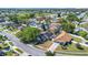 Aerial view of neighborhood with lush trees and well-manicured lawns at 8630 Fort Jefferson Blvd, Orlando, FL 32822