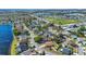 Scenic aerial shot showcases a lakeside residential community with tree-lined streets and well-kept homes with lush landscaping at 8630 Fort Jefferson Blvd, Orlando, FL 32822